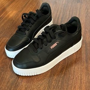 Black leather Puma sneakers worn once and size 8.